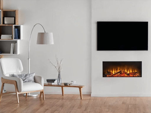 Acantha Aspire 75 inset media fire in wall with chair and lamp